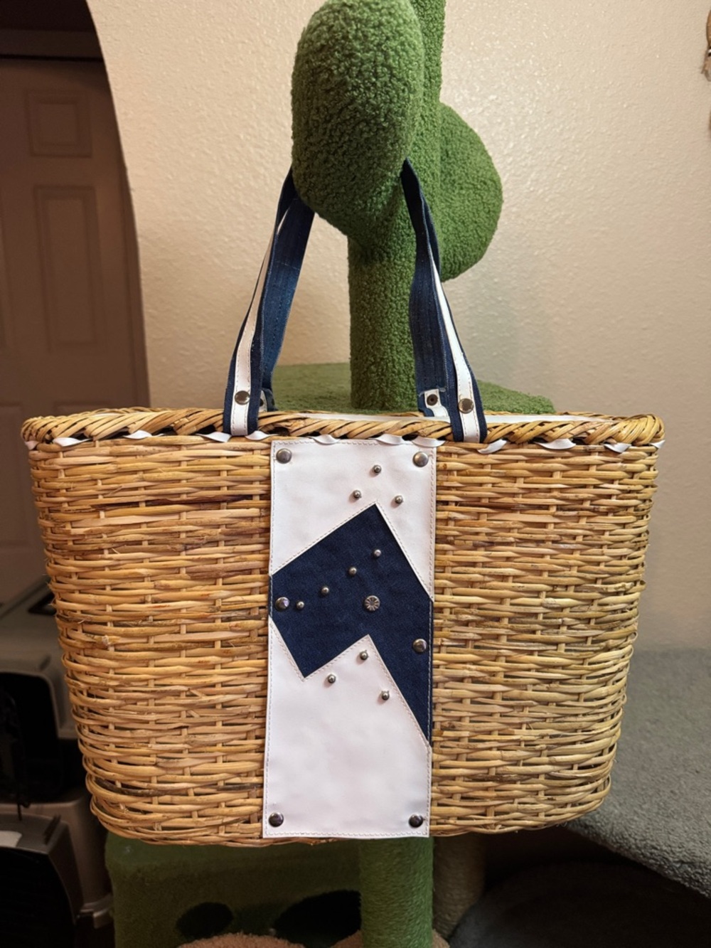 Woven Straw Tote Bag with Navy denim Accent Silvertone studs. Resort beach